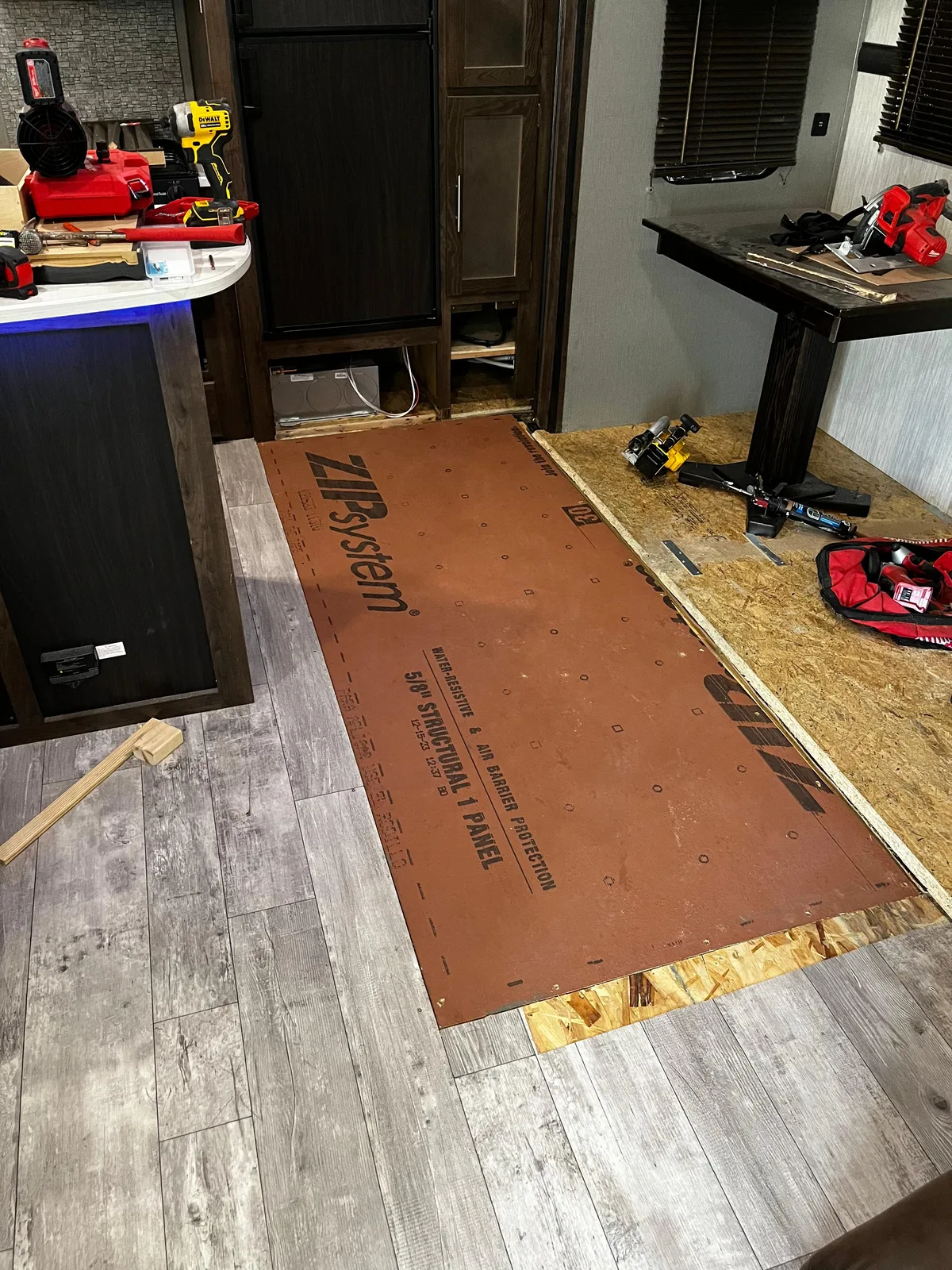 Tidepool RV technician fixing the floor after a water leak inside an RV